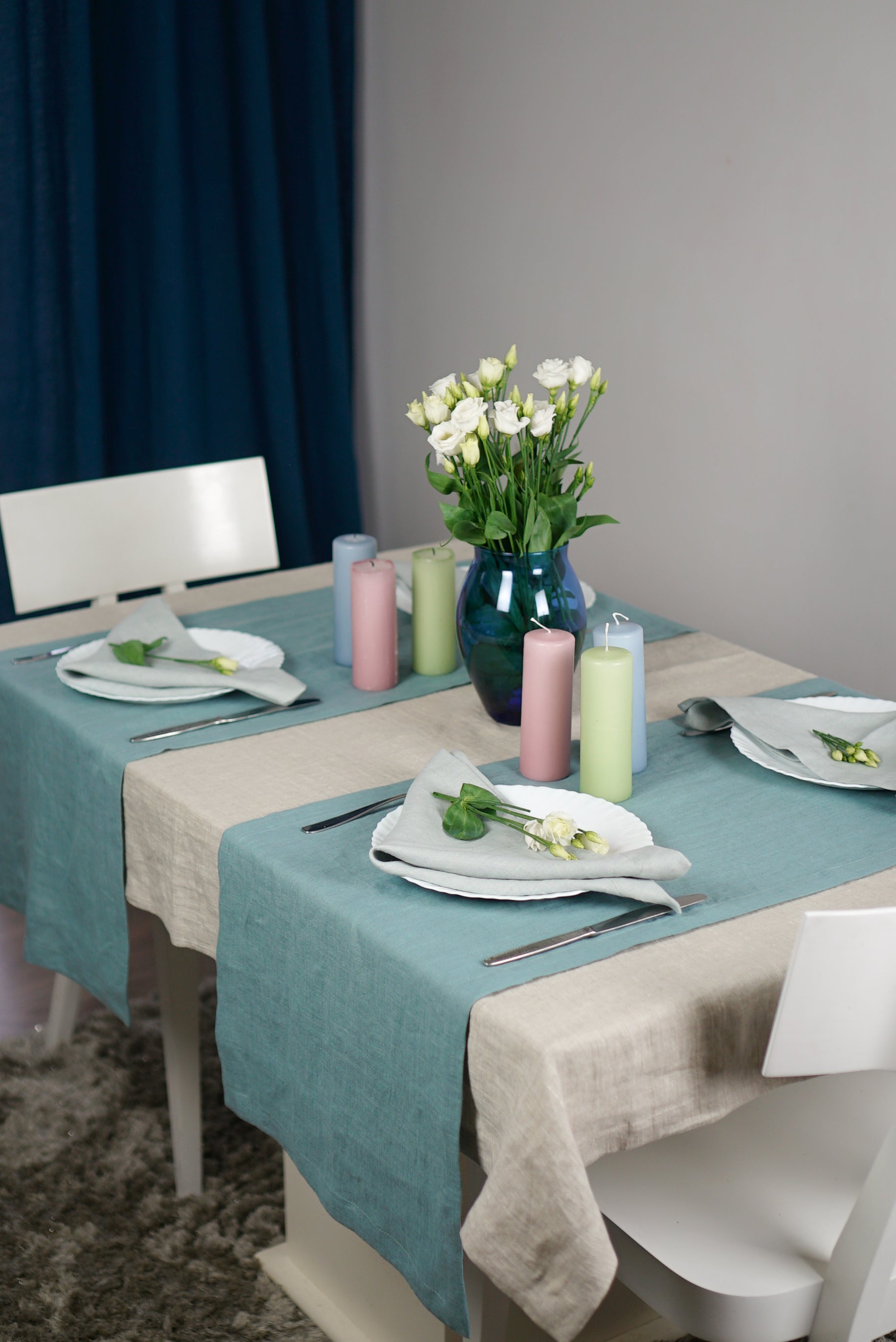 Elegant linen tablecloths in various colors and sizes, showcasing high-quality European linen with a decorative hem.