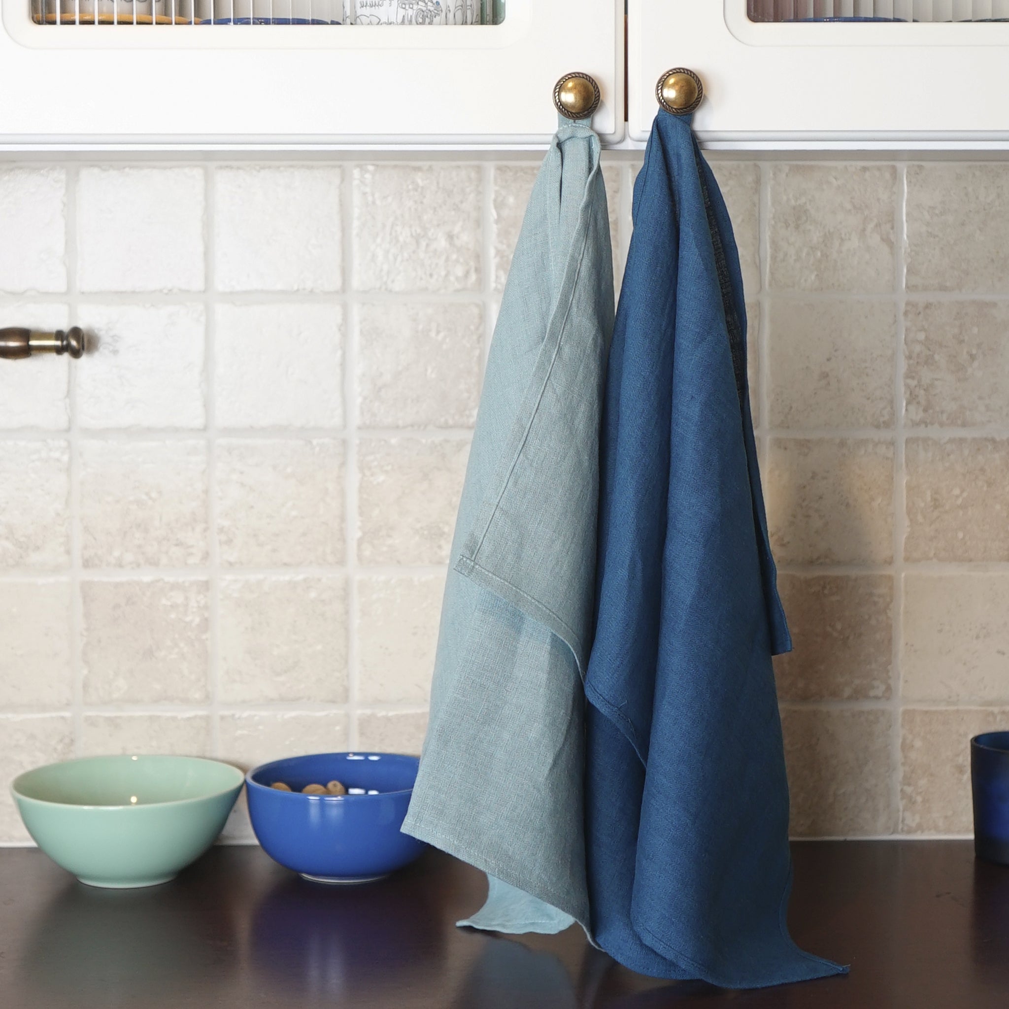 Elegant stonewashed linen tea towel in various colors, perfect for kitchen use.