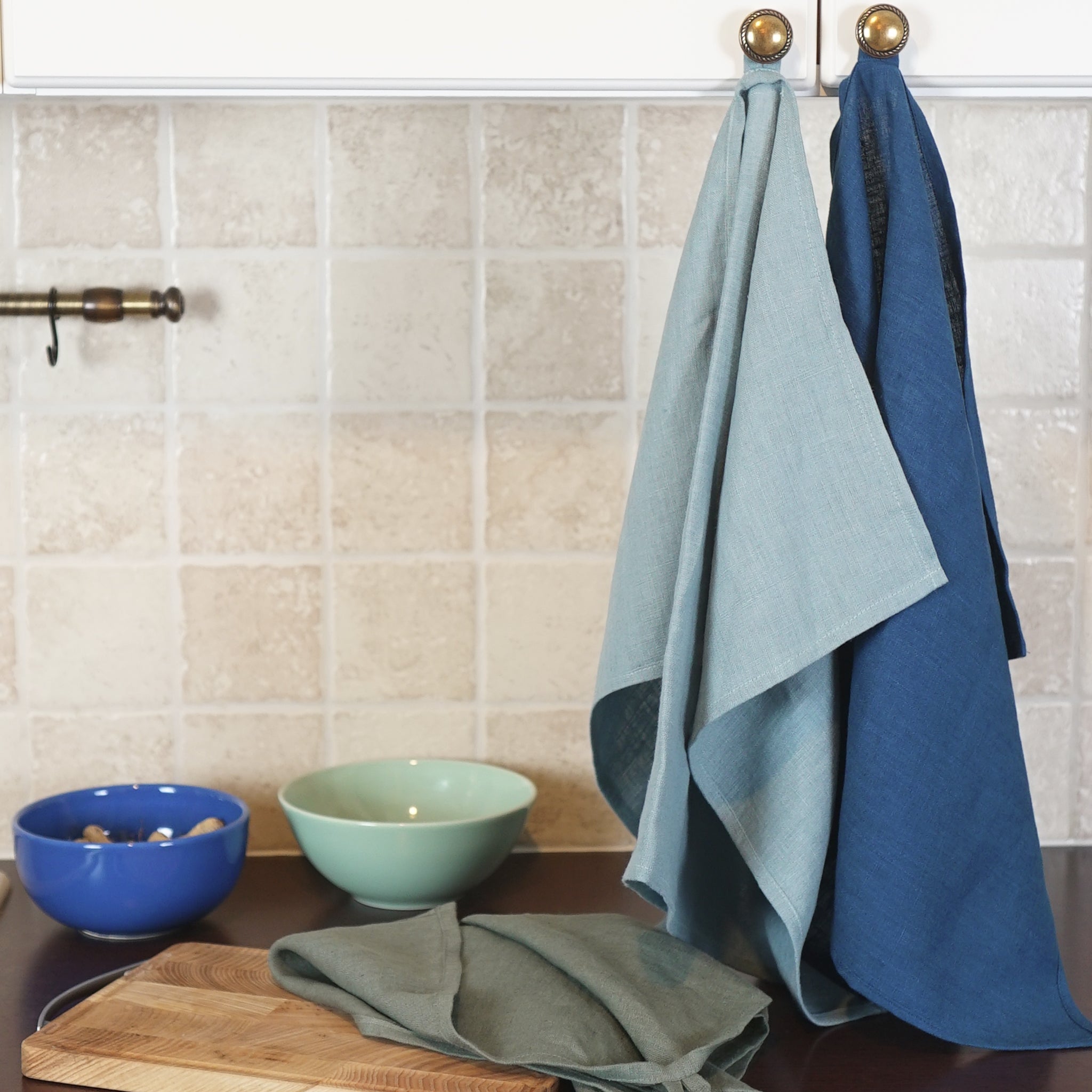 Elegant stonewashed linen tea towel in various colors, perfect for kitchen use.