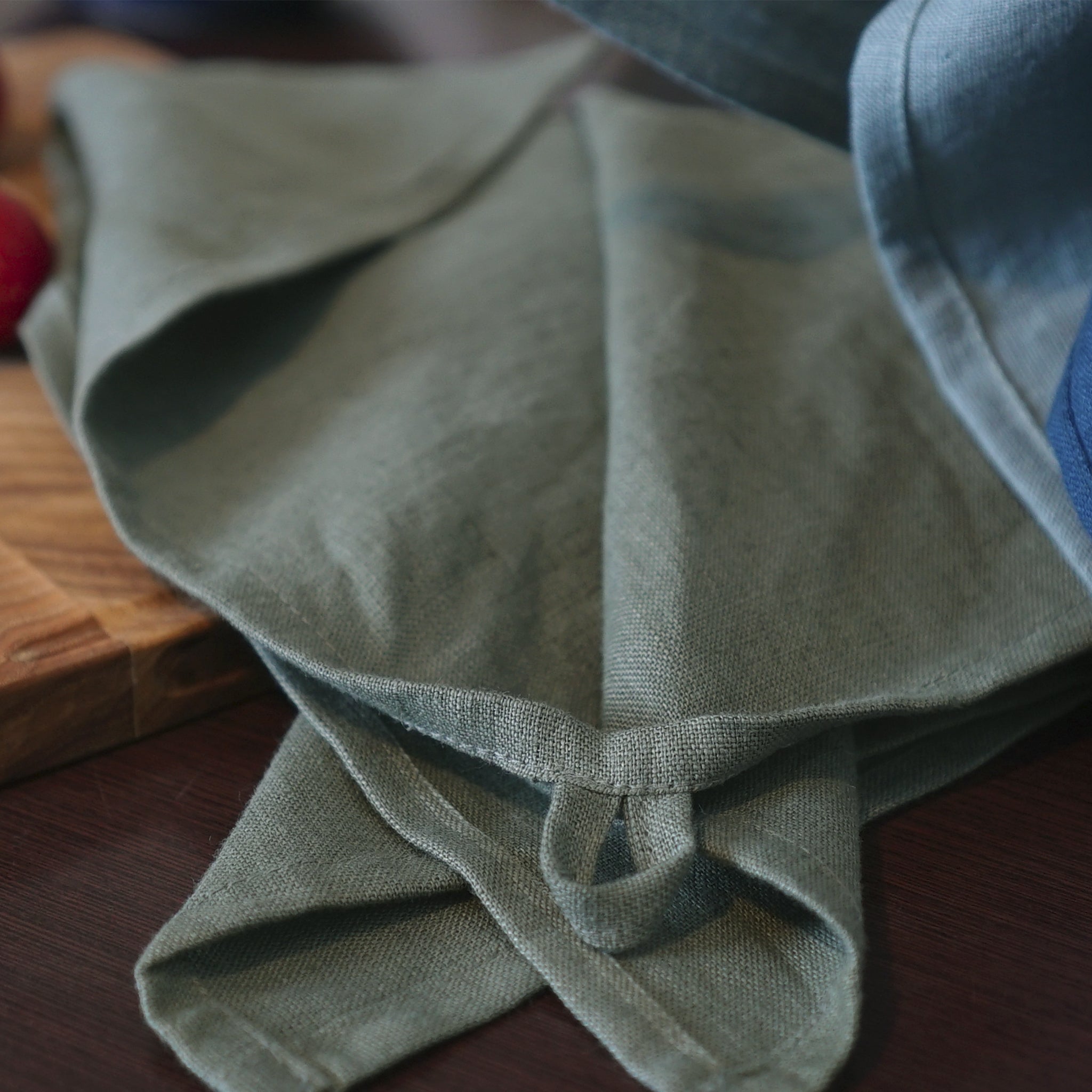 Elegant stonewashed linen tea towel in various colors, perfect for kitchen use.