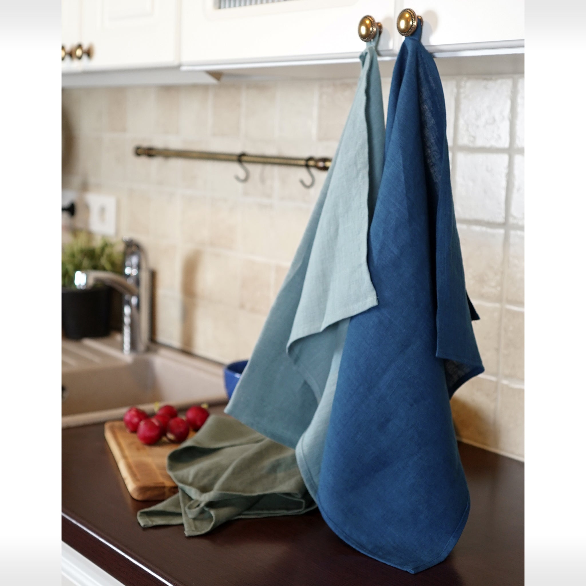 Elegant stonewashed linen tea towel in various colors, perfect for kitchen use.