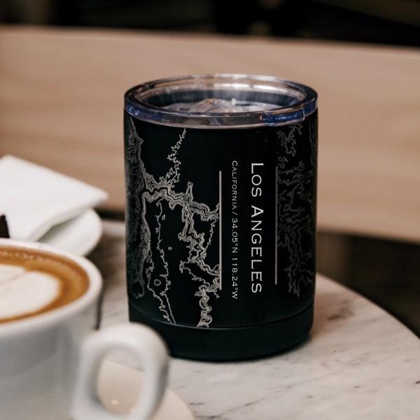 Matte black insulated cup featuring a custom engraved map of Los Angeles, California with coordinates.