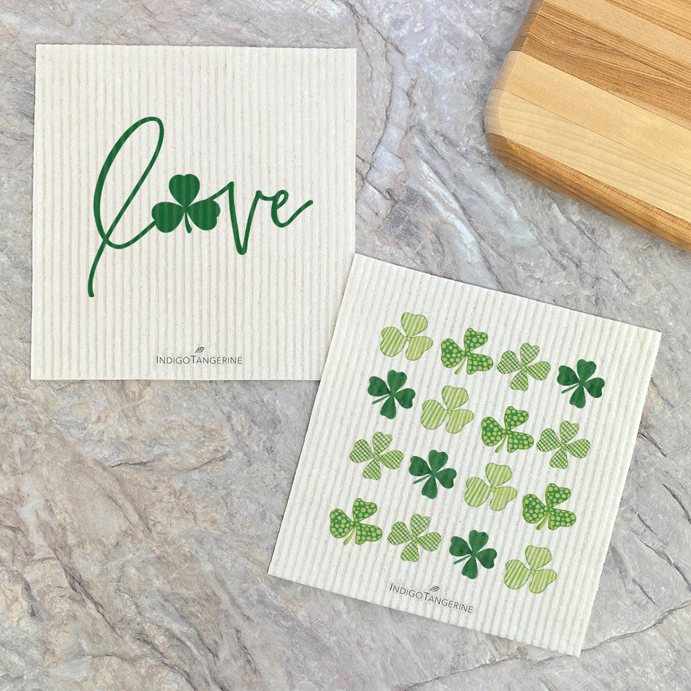 Two Swedish dish cloths featuring shamrock designs, eco-friendly and reusable.