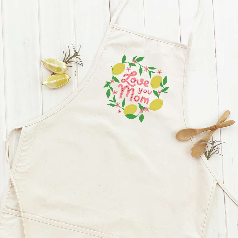 Love You Mom (Lemons) Women's Apron featuring a cheerful lemon design, adjustable neck strap, and divided front pocket.