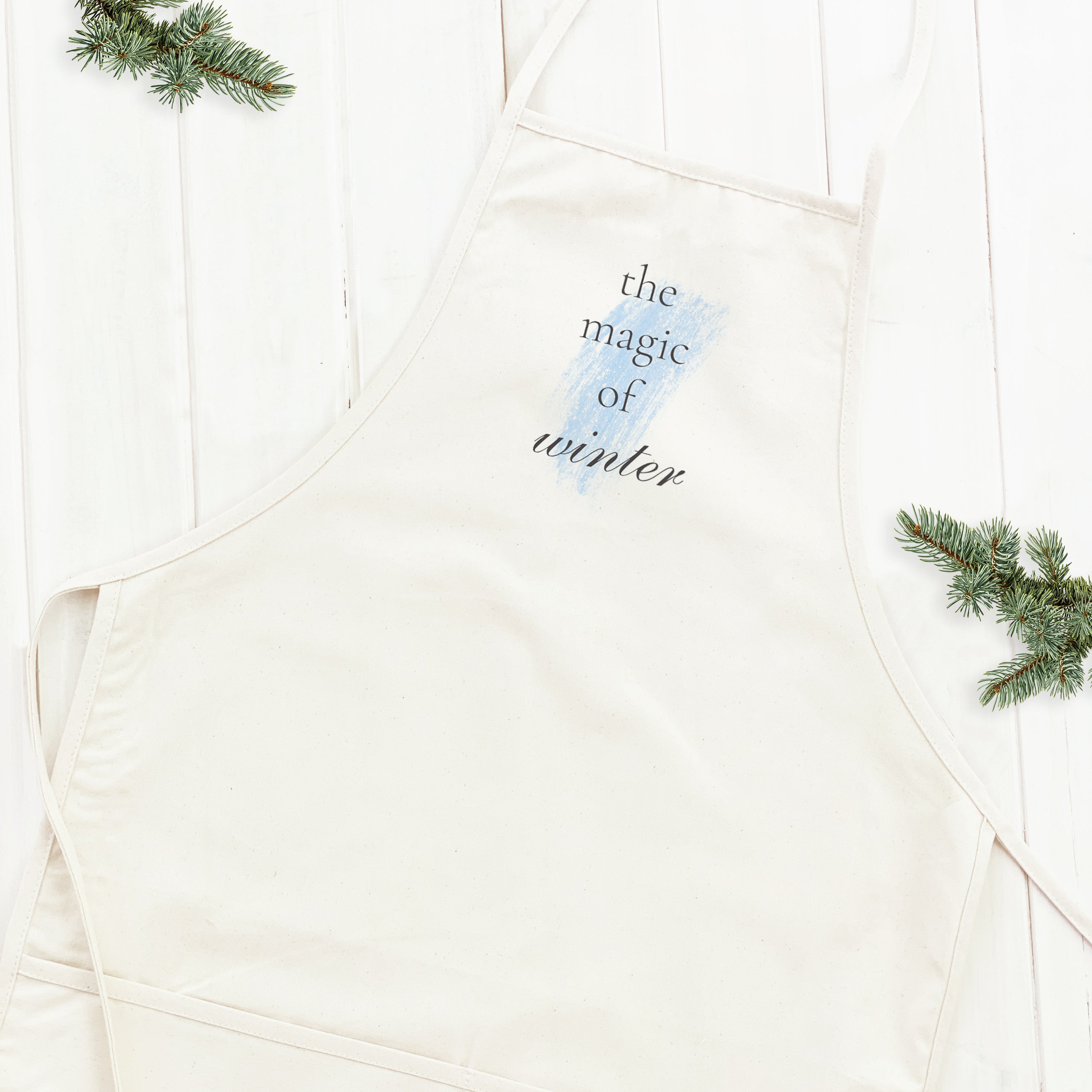 Magic of Winter Women's Apron featuring elegant design, adjustable neck, and divided front pocket, made from durable cotton canvas.