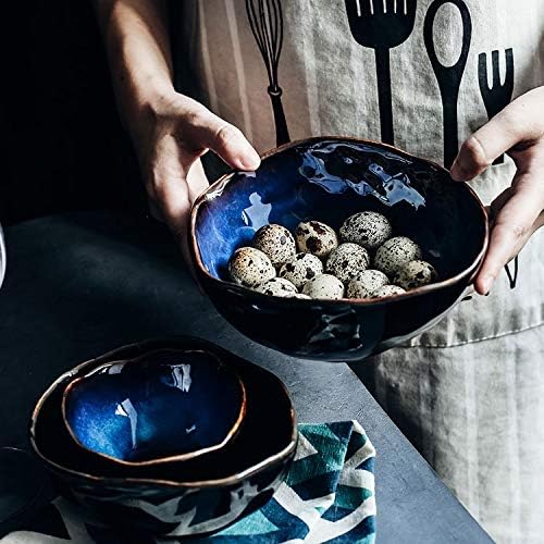 Maana Bowl featuring dark blue ceramic with golden stripes, elegantly designed for serving and decoration.