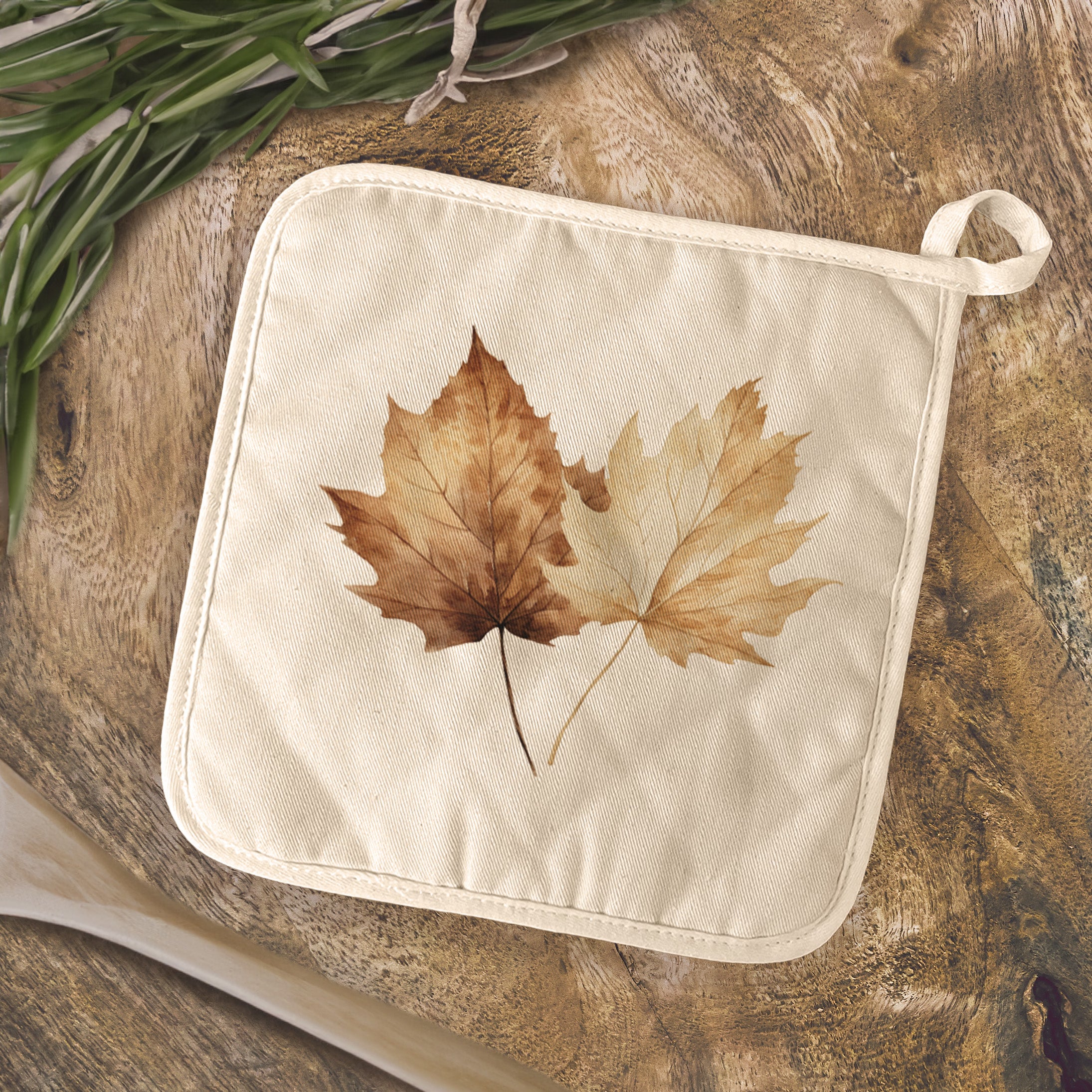 Maple Leaves Cotton Pot Holder featuring vibrant leaf designs on a natural-color fabric, perfect for kitchen use.