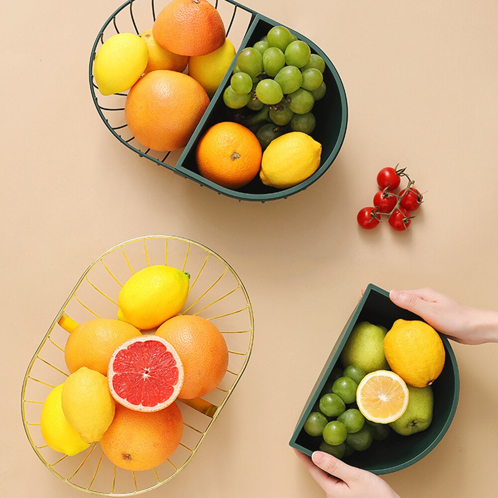 A stylish metal hollowed out fruit and vegetable snack tray bowl basket in dark green and gold, showcasing a variety of fresh fruits and snacks.