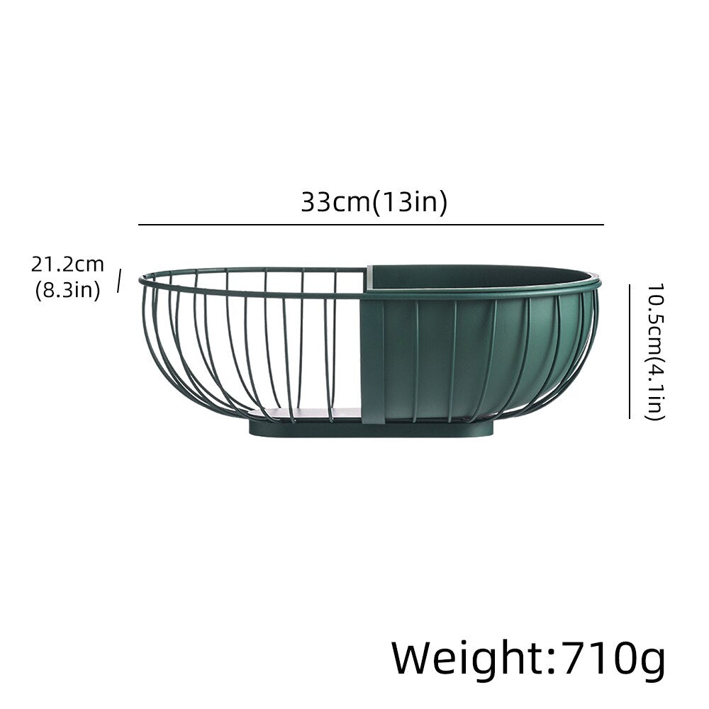 A stylish metal hollowed out fruit and vegetable snack tray bowl basket in dark green and gold, showcasing a variety of fresh fruits and snacks.