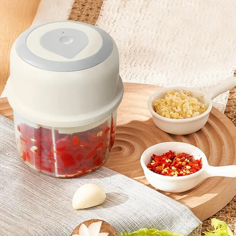 Mini Garlic Chopper Wireless Onion Food Prep Machine with stainless steel cutter and compact design, perfect for efficient meal preparation.