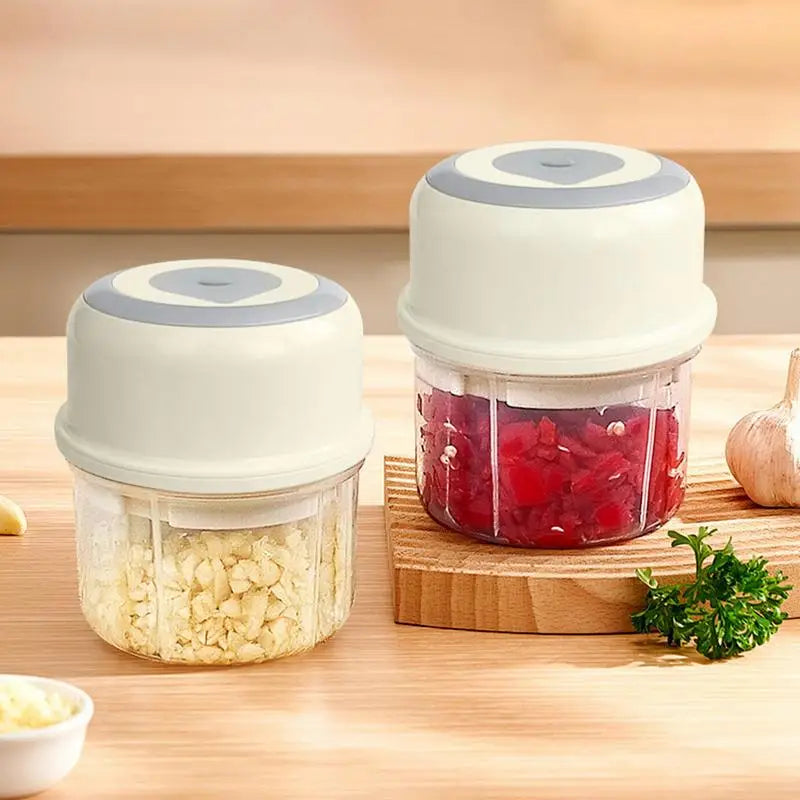 Mini Garlic Chopper Wireless Onion Food Prep Machine with stainless steel cutter and compact design, perfect for efficient meal preparation.