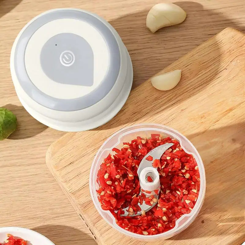 Mini Garlic Chopper Wireless Onion Food Prep Machine with stainless steel cutter and compact design, perfect for efficient meal preparation.