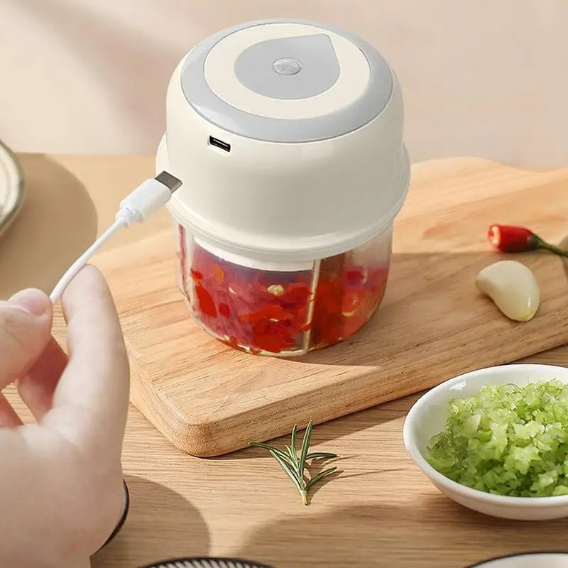 Mini Garlic Chopper Wireless Onion Food Prep Machine with stainless steel cutter and compact design, perfect for efficient meal preparation.