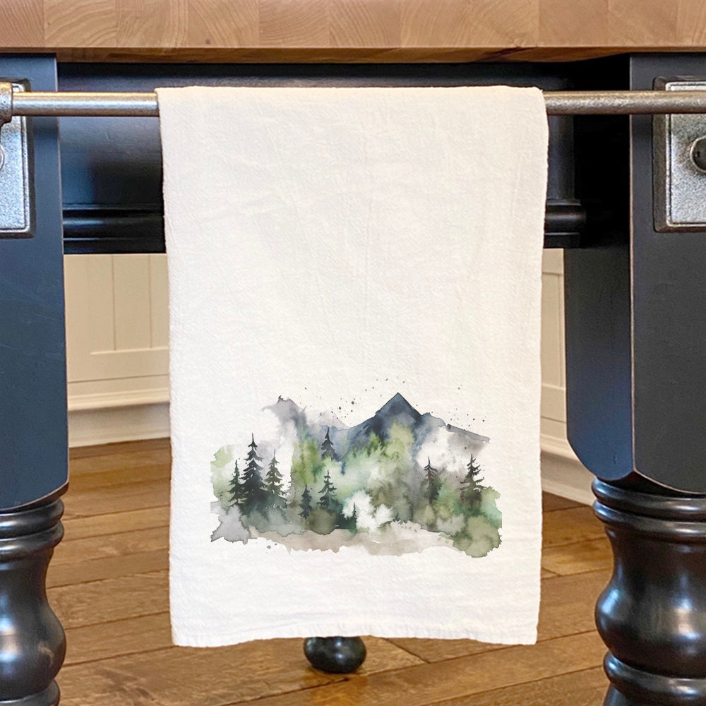 Misty Green Mountains cotton tea towel featuring a vibrant mountain design, perfect for kitchen use.