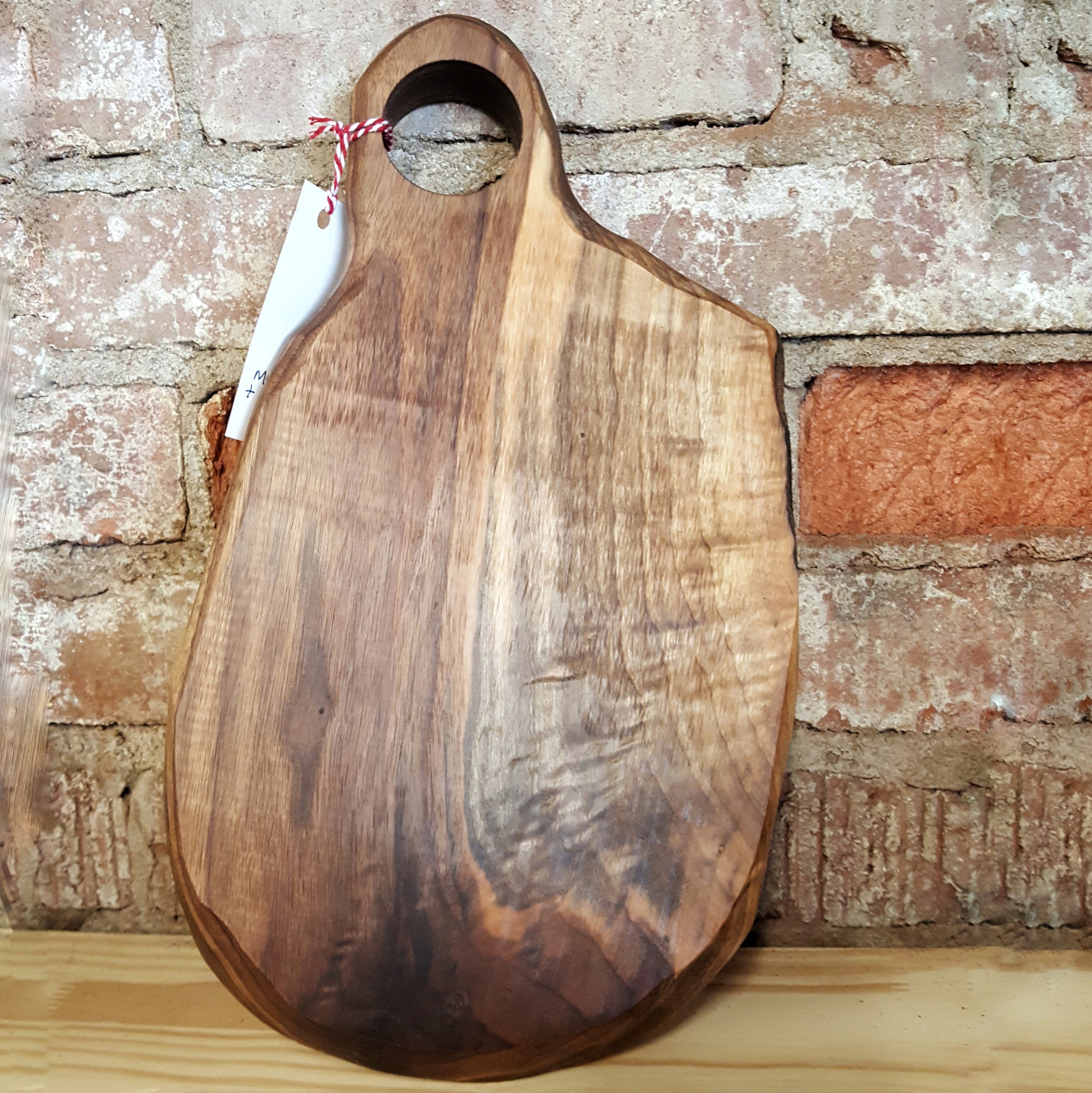 Modern Oblong Cheese Serving Tray made of walnut, featuring a unique teacup-inspired shape, perfect for serving cheese and appetizers.