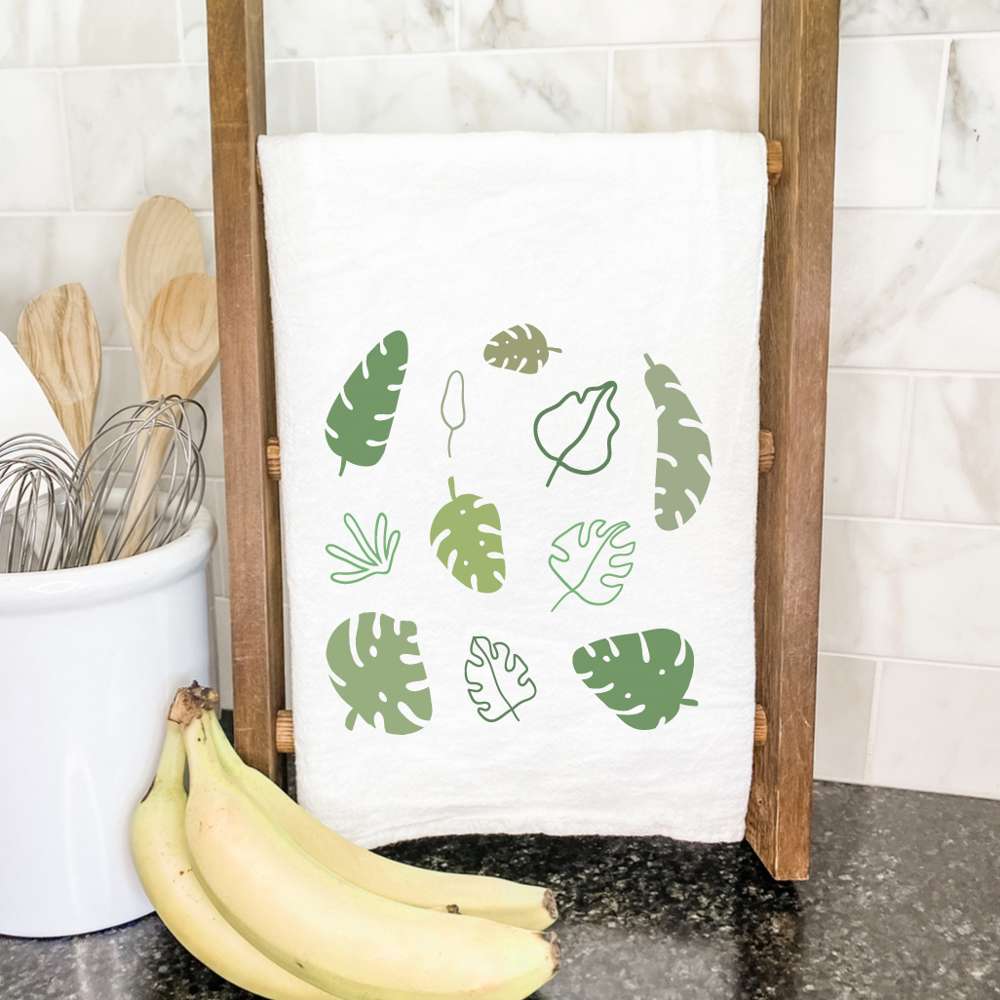 Monstera Palm Leaves cotton tea towel featuring vibrant green palm leaf design on a white background, perfect for kitchen use.