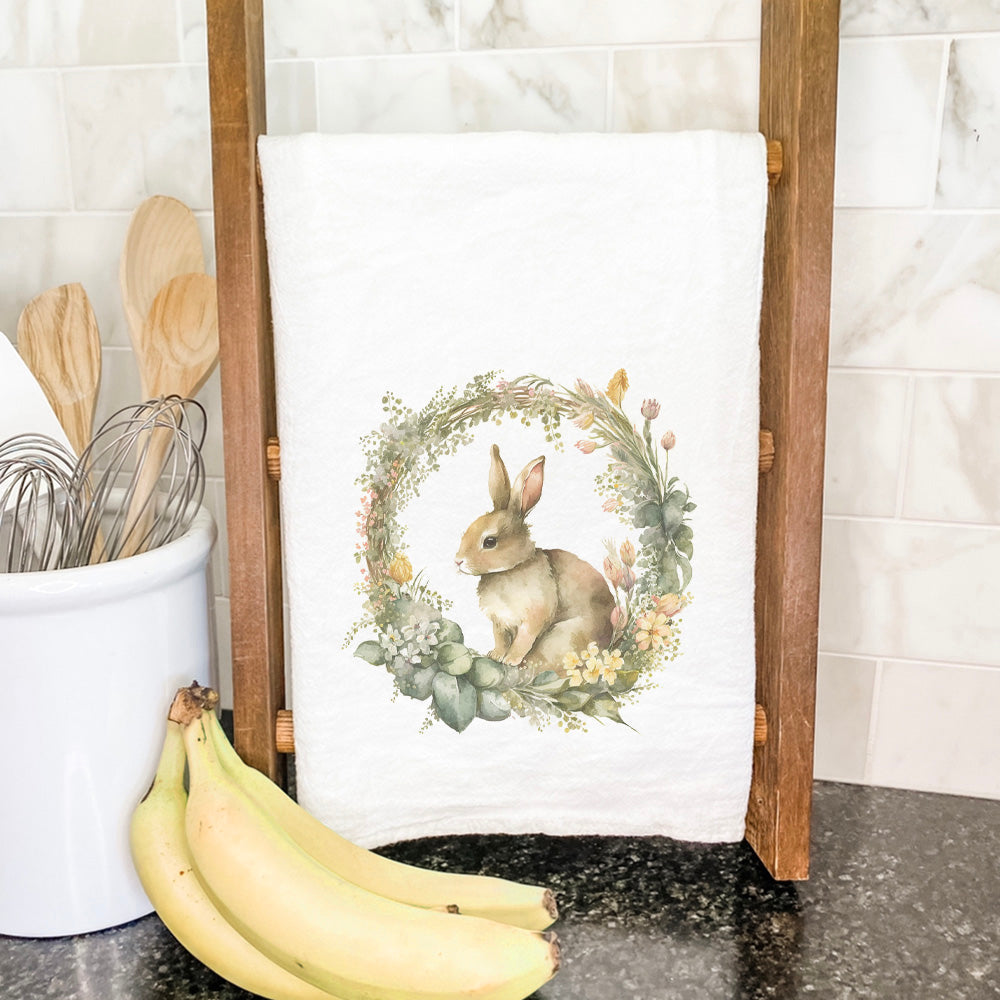 Muted Bunny Wreath cotton tea towel featuring a charming design, perfect for kitchen use.