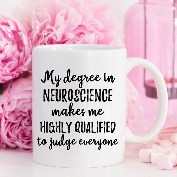 A white ceramic mug featuring a vibrant neuroscience design printed on both sides, ideal for coffee lovers and science enthusiasts.