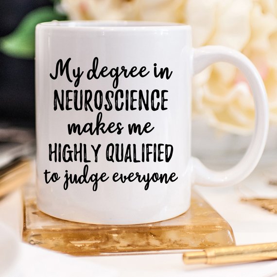 A white ceramic mug featuring a vibrant neuroscience design printed on both sides, ideal for coffee lovers and science enthusiasts.