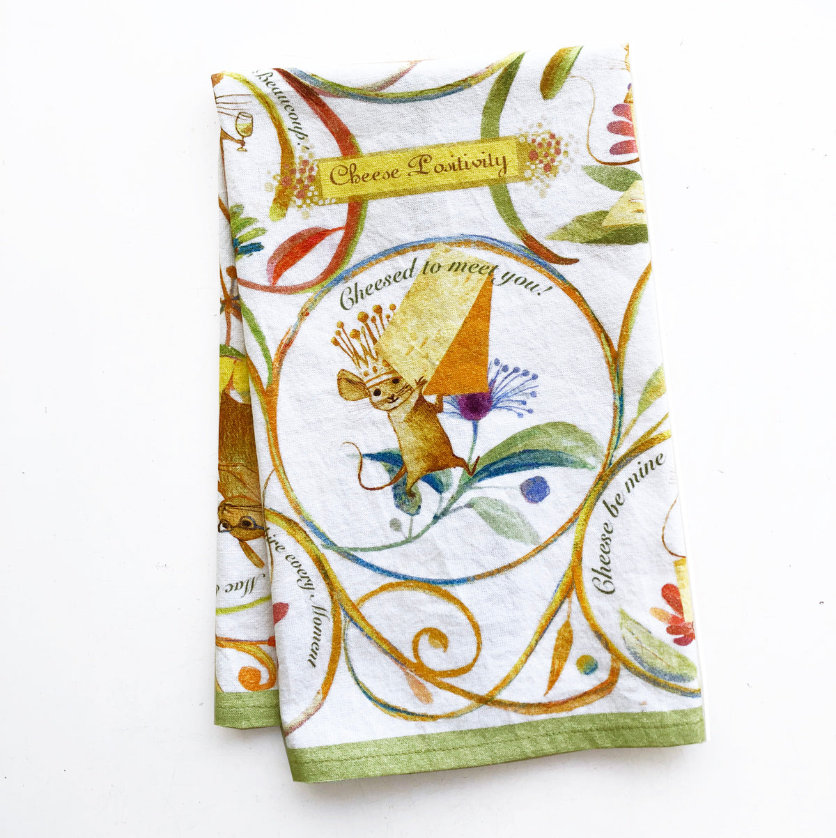 Cheese Positivity Tea Towel featuring vibrant cheese-themed design, made of 100% cotton with a corner loop for hanging.