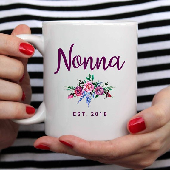 A white Nonna Mug made from high-grade ceramic, featuring a vibrant design printed on both sides, perfect for coffee lovers.