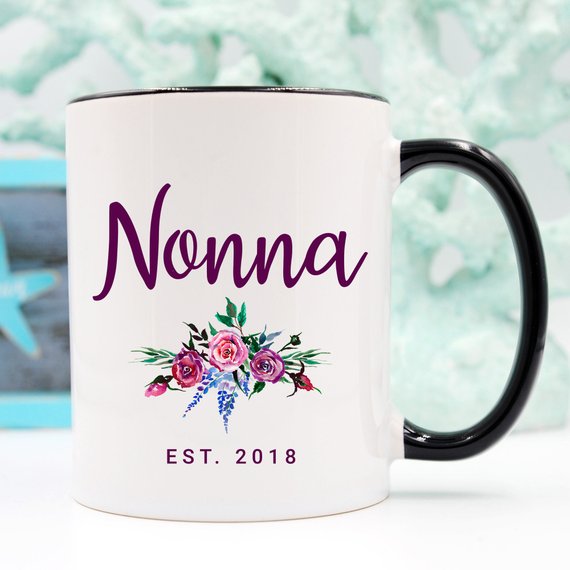 A white Nonna Mug made from high-grade ceramic, featuring a vibrant design printed on both sides, perfect for coffee lovers.