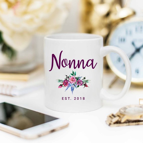 A white Nonna Mug made from high-grade ceramic, featuring a vibrant design printed on both sides, perfect for coffee lovers.