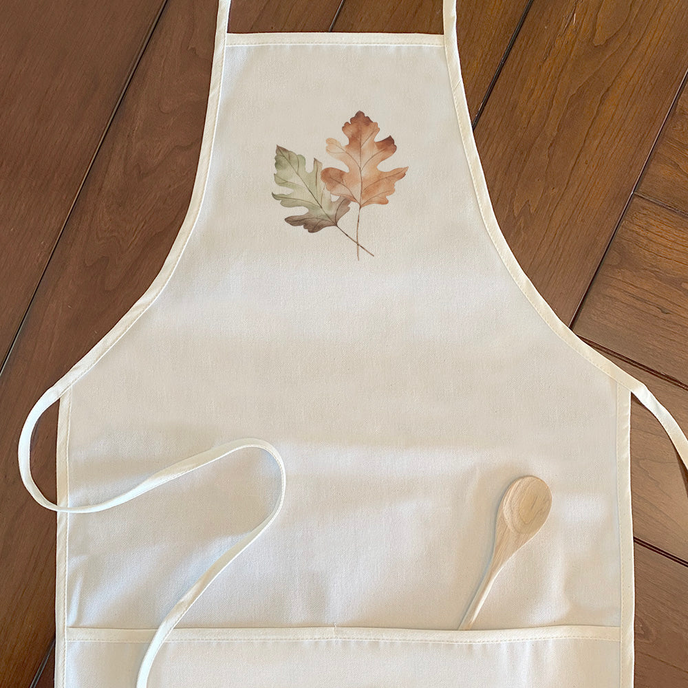 Oak Leaves Women's Apron made from durable cotton canvas with natural twill ties and a divided front pocket.