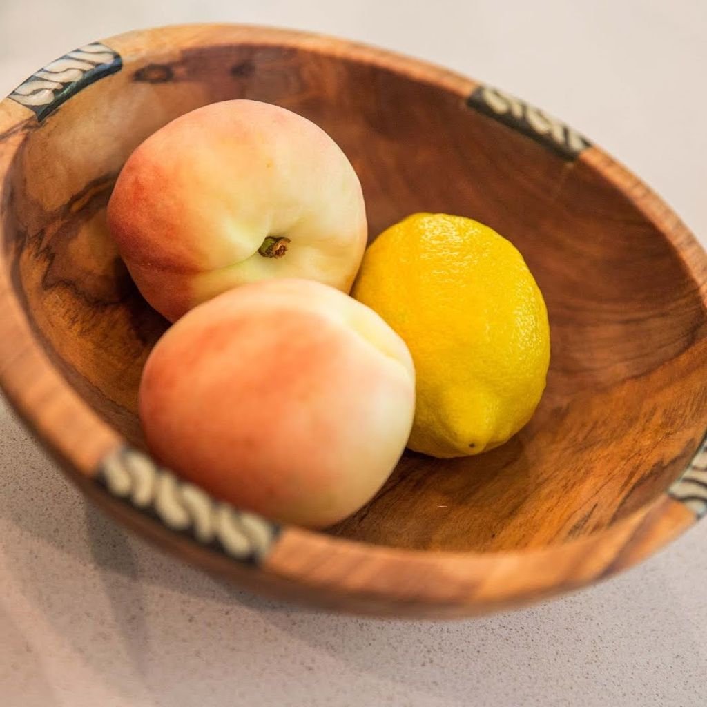 Handmade Olivewood Salad and Fruit Bowl with Cow Bone inlay, showcasing unique grain patterns and ethnic design.