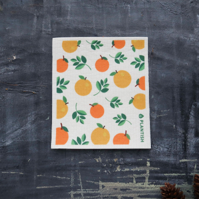 Orange Swedish Sponge Cloth with a vibrant citrus print, perfect for eco-friendly cleaning.