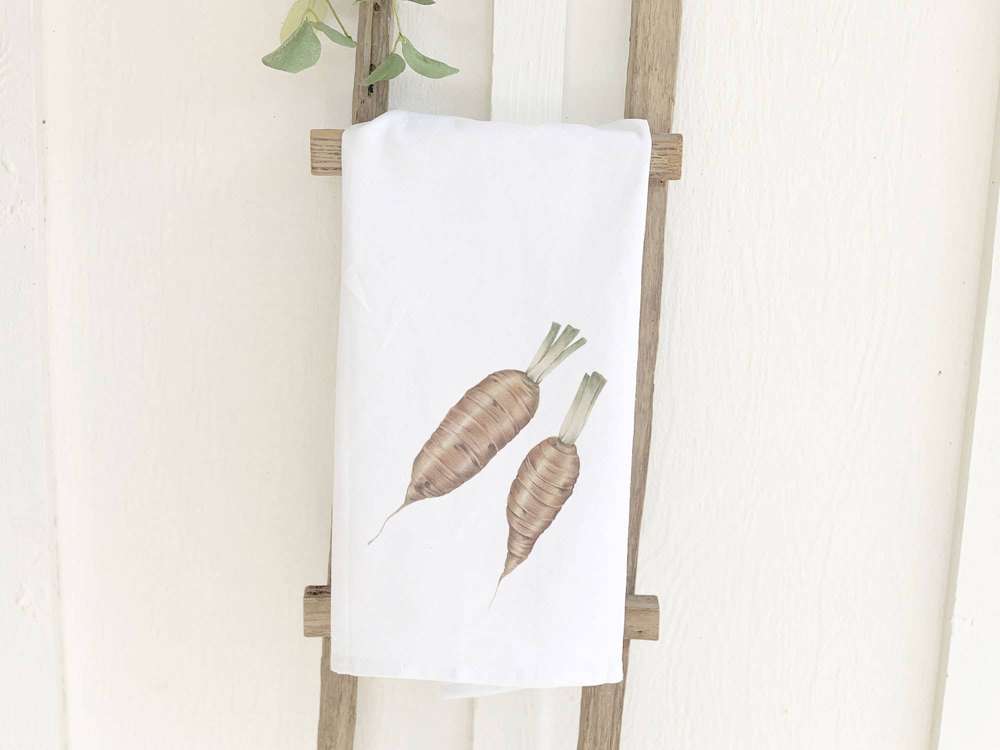 A vibrant cotton tea towel featuring a beautiful organic carrots design, perfect for kitchen use.