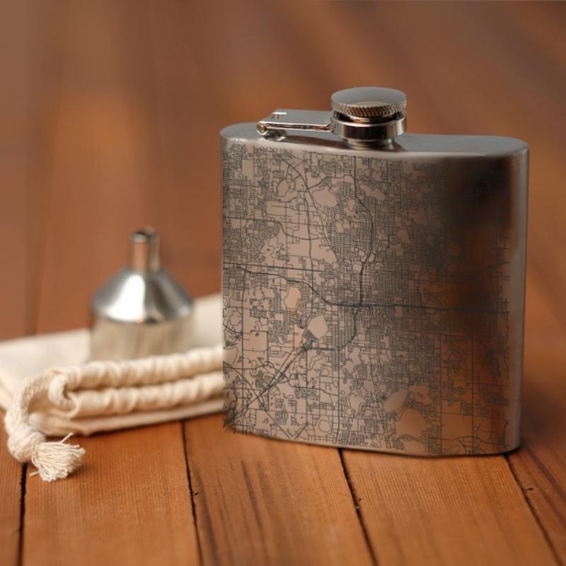 Custom engraved 6oz hip flask featuring a detailed map of Orlando, Florida with coordinates, accompanied by a canvas bag and funnel.