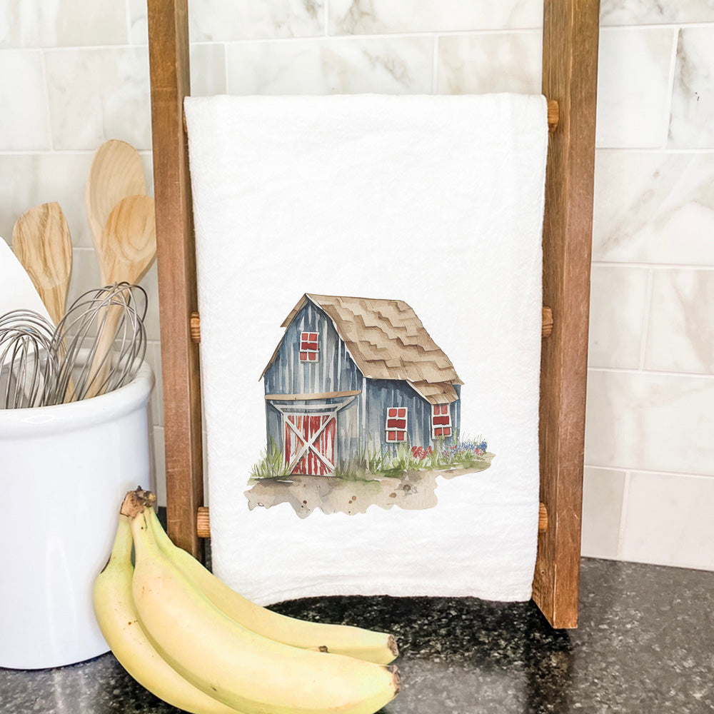 A vibrant Painted Barn Cotton Tea Towel featuring a rustic barn design, made from 100% absorbent cotton, perfect for kitchen use.