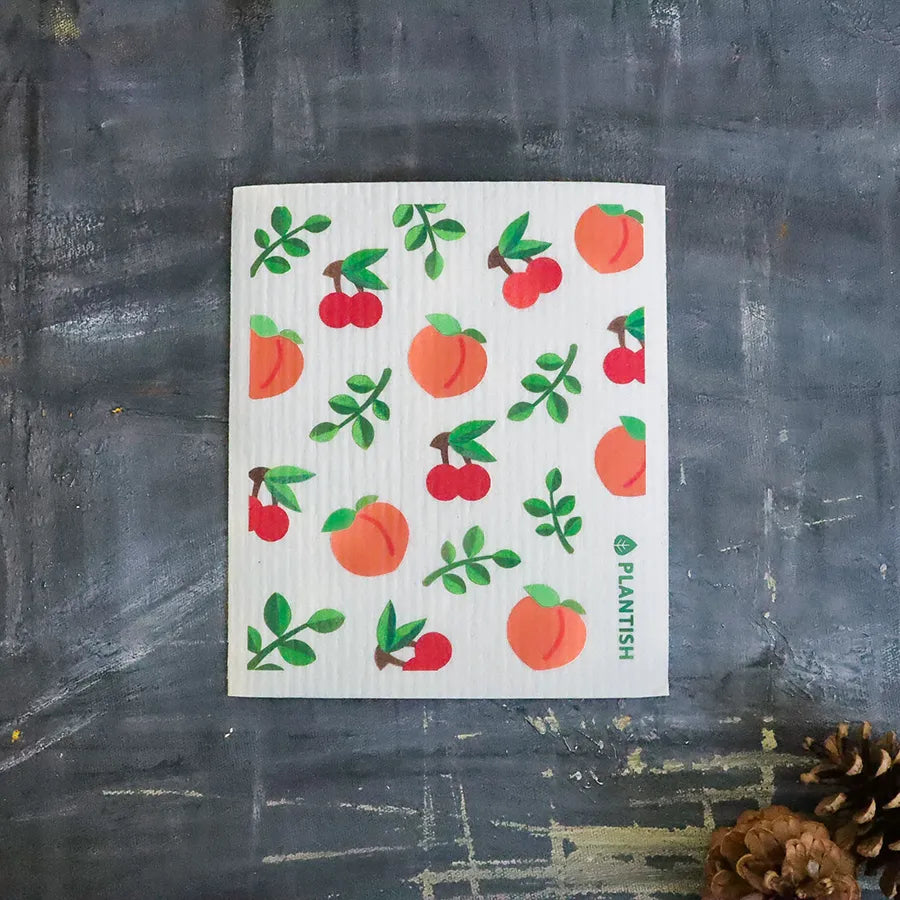 Peach Swedish Sponge Cloth with playful peach design, ideal for eco-friendly cleaning.