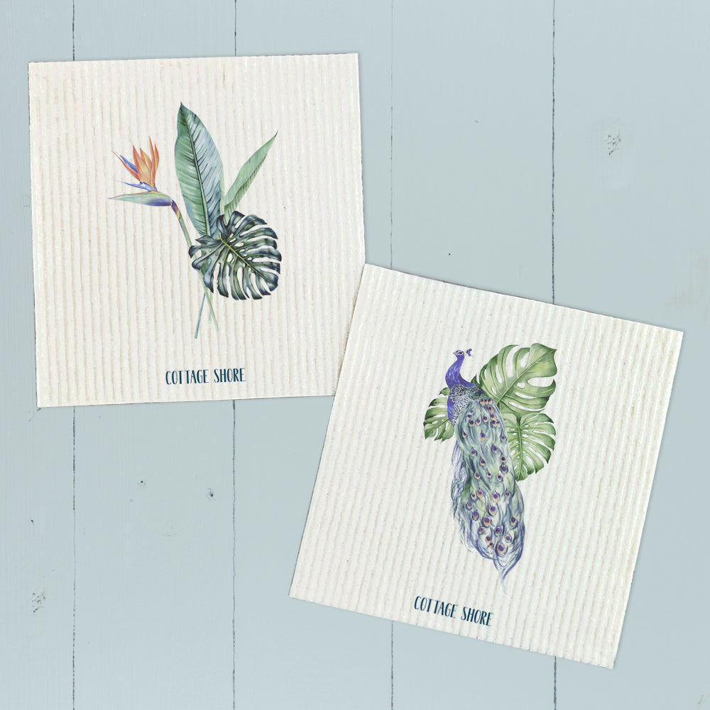 Two Swedish dish cloths featuring a vibrant peacock and monstera design, showcasing eco-friendly materials.