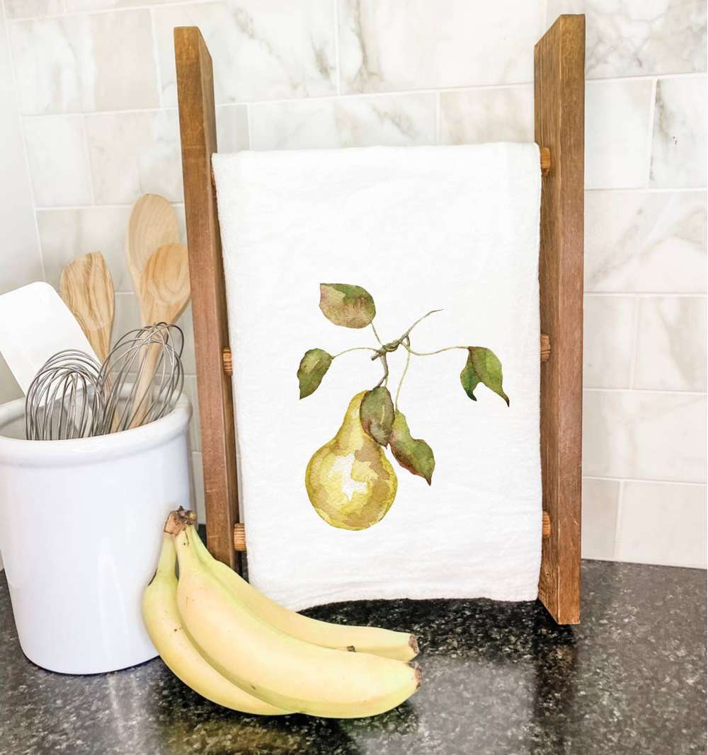 A vibrant cotton tea towel featuring a pear design, showcasing its absorbent texture and hemmed edges.