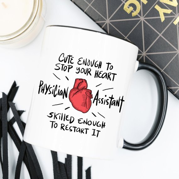 A humorous coffee mug designed for Physician Assistants, featuring the phrase 'Cute Enough To Stop Your Heart' in a vibrant print on a white ceramic background.