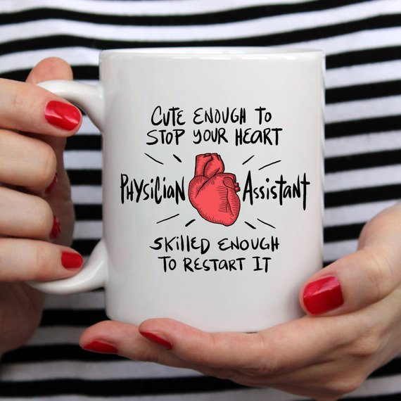 A humorous coffee mug designed for Physician Assistants, featuring the phrase 'Cute Enough To Stop Your Heart' in a vibrant print on a white ceramic background.