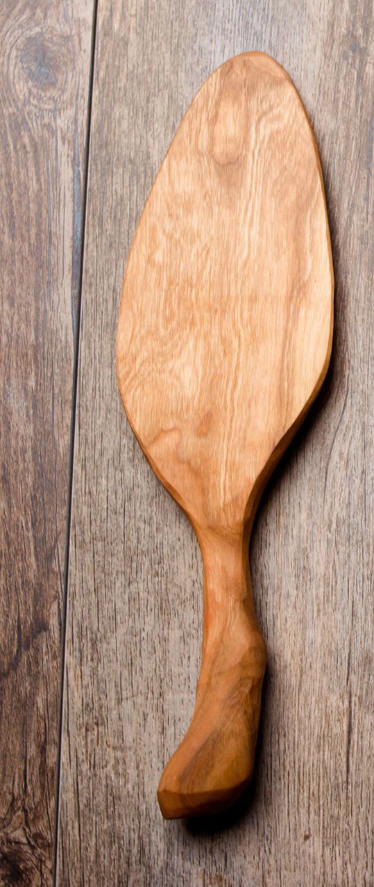 Handcarved wooden pie and cake serving utensil with a large flat tip and chiseled handle, available in various wood types.