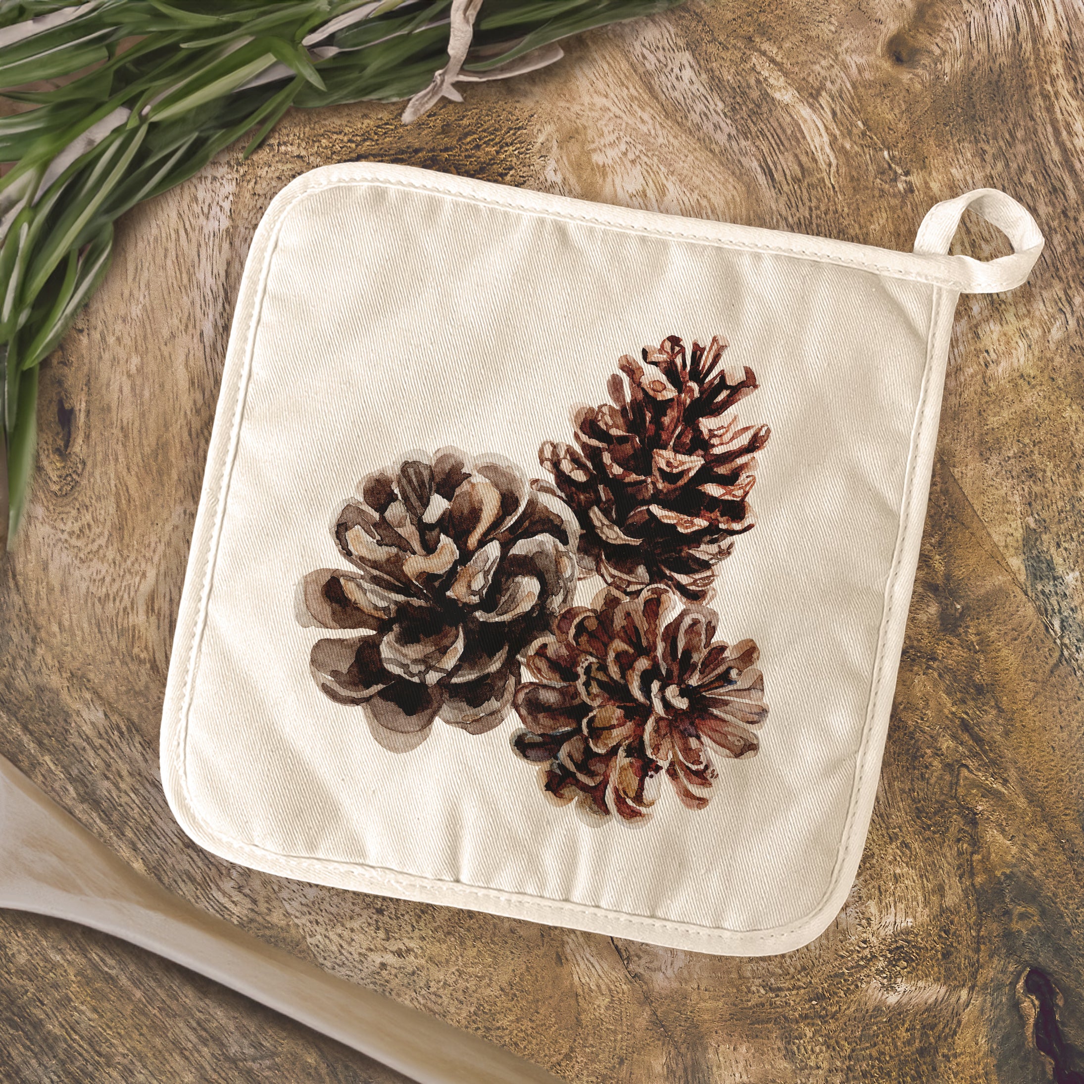 Pinecones Cotton Pot Holder featuring a rustic design with vibrant colors, made from durable cotton and terry cloth.