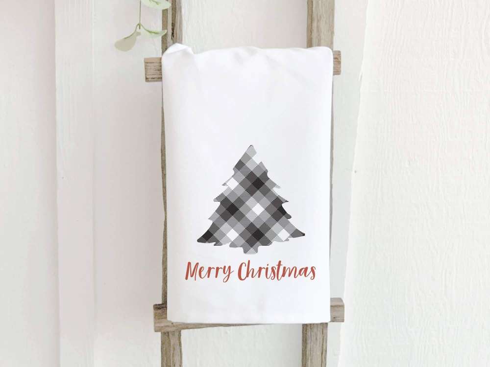 Plaid Christmas Tree cotton tea towel featuring vibrant colors and hemmed edges, perfect for holiday kitchen decor.