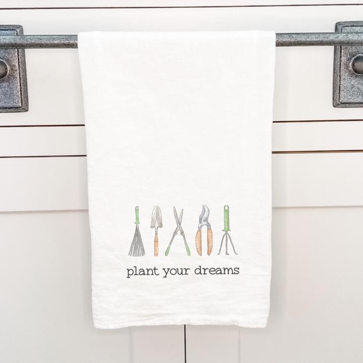 Plant your Dreams cotton tea towel featuring vibrant water-based ink design, perfect for kitchen use.