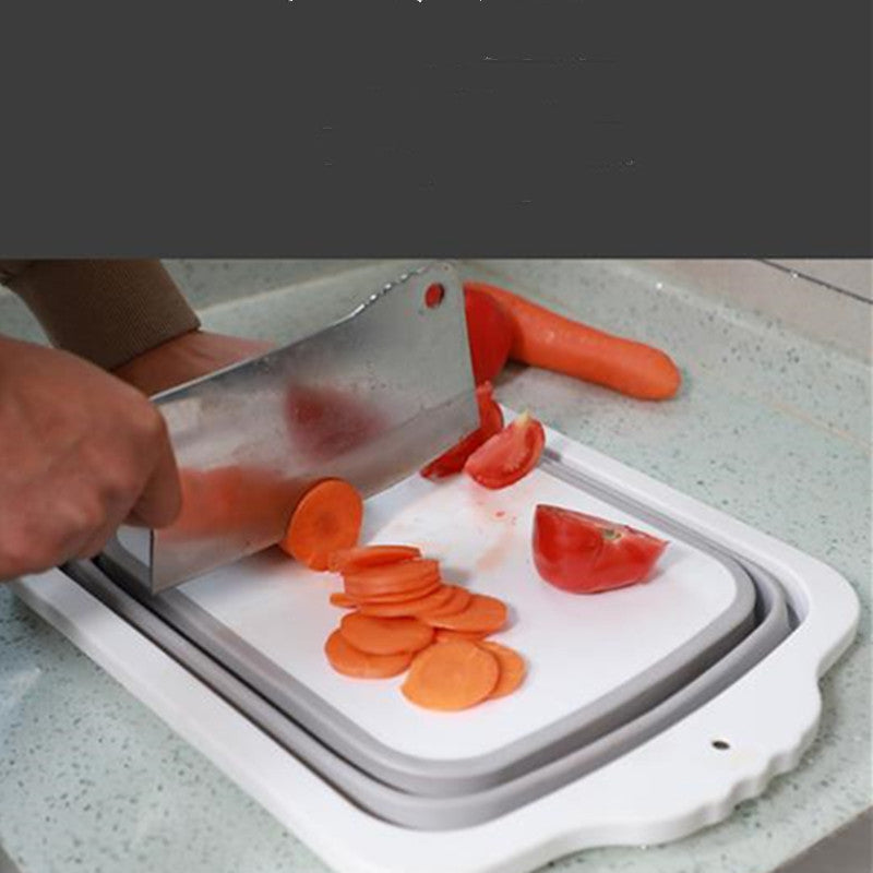 Plastic Multifunctional Folding Cutting Board with strainers, showcasing its ergonomic and space-saving design.