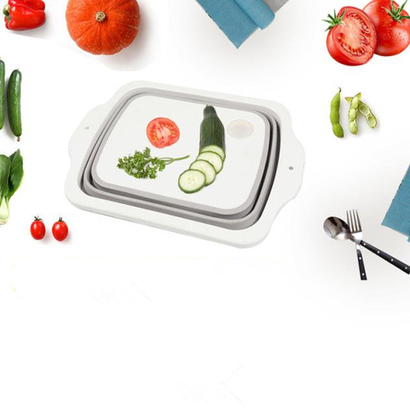 Plastic Multifunctional Folding Cutting Board with strainers, showcasing its ergonomic and space-saving design.