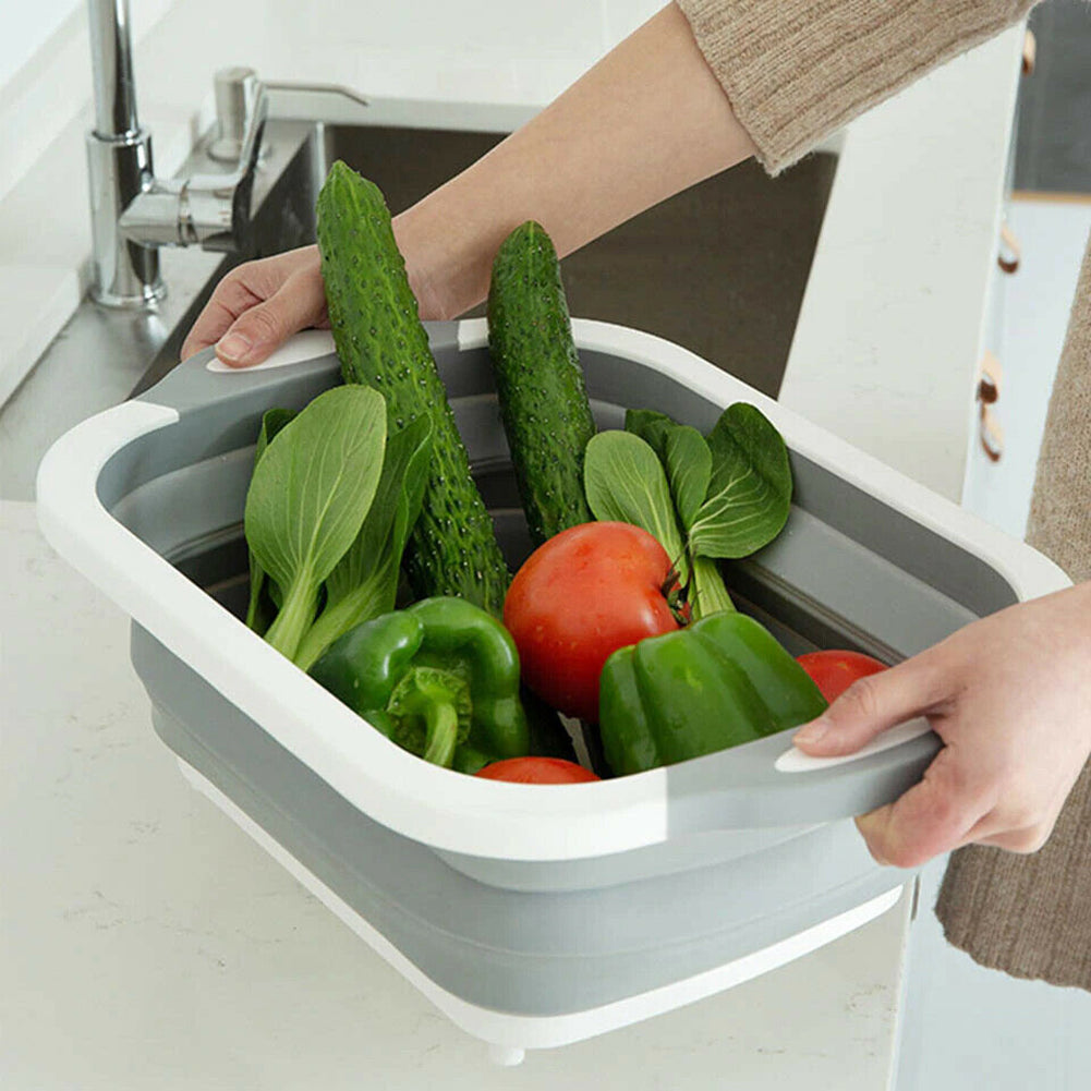 Plastic Multifunctional Folding Cutting Board with strainers, showcasing its ergonomic and space-saving design.