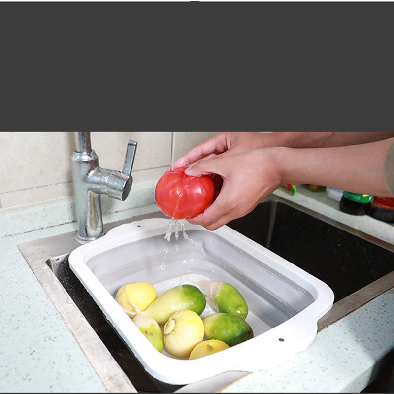 Plastic Multifunctional Folding Cutting Board with strainers, showcasing its ergonomic and space-saving design.