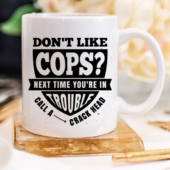 Funny Police Officer Mug with humorous text, perfect gift for law enforcement fans.