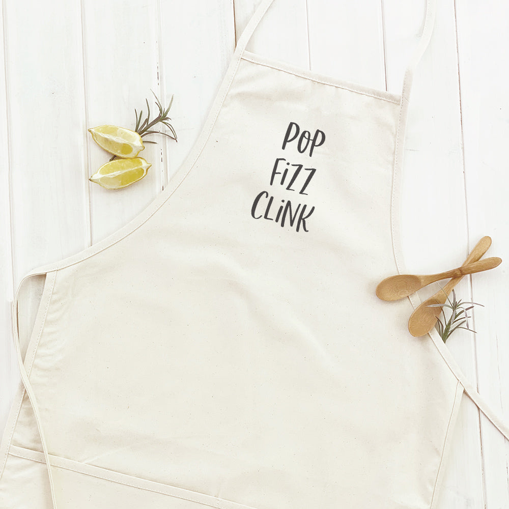 Pop Fizz Clink Women's Apron in elegant design, made of cotton canvas with adjustable neck and twill ties, featuring a divided front pocket.