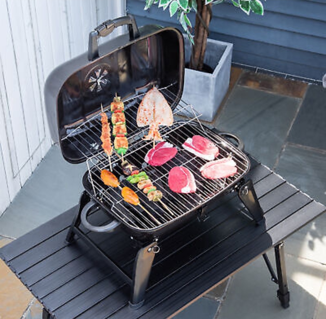 Portable Tabletop BBQ Charcoal Grill with foldable design, ideal for outdoor cooking.