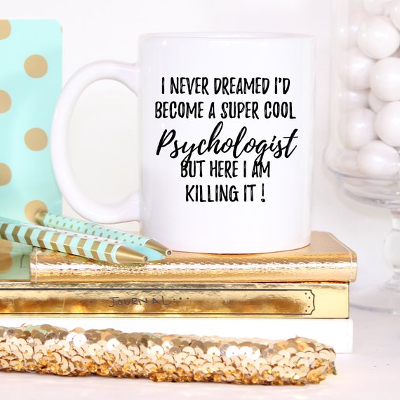 A white ceramic mug featuring a humorous psychologist design, printed on both sides, perfect for coffee or tea.